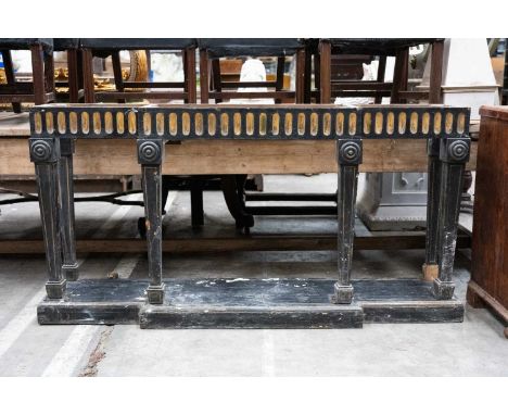 REGENCY STYLE PARCEL-GILT & EBONISED BREAKFRONT SERVING TABLE BASE, fluted frieze, tapering square section legs headed by rou