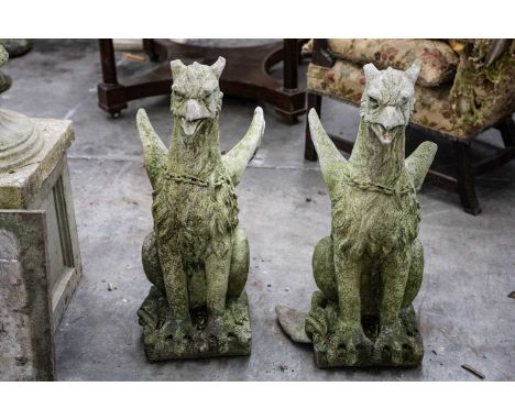 PAIR OF RECONSTITUTED STONE GRIFFONS, modelled seated facing front, 74cms (h) (2)Comments: one with broken wing, both broken 