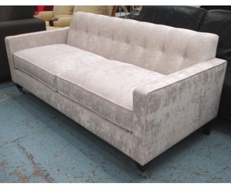 SOFA, contemporary design in shimmering white buttoned back upholstery on shaped legs with chrome castors, 176cm x 80cm H x 8