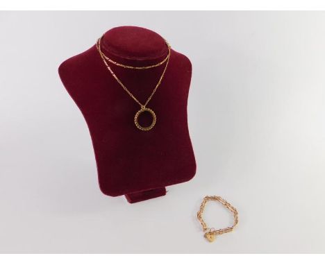 A 9ct gold three bar gate bracelet, on a heart shaped, padlock clasp, with safety chain as fitted, and a 9ct gold sovereign p