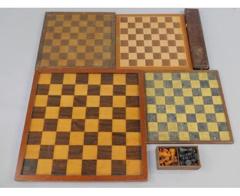A mahogany framed rosewood and maple chess board, 61cm x 61cm, three further chess boards, Staunton type chess set, and a cri