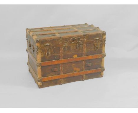 A Nico canvas and wooden bound trunk, of domed rectangular form, with iron work detailing, 82cm x 51.5cm x 57.5cm.