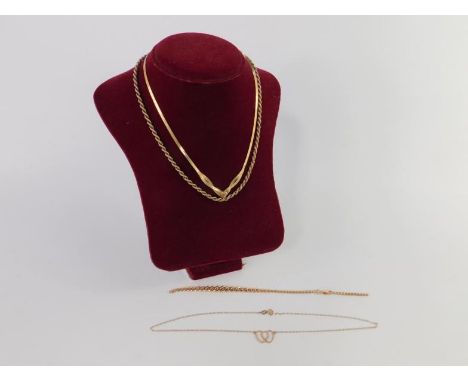 A 9ct gold curb link bracelet, on a snap clasp, 9ct gold herringbone necklace with a heart shaped terminal, 9ct gold interloc