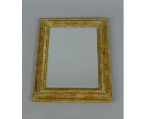 A rectangular gilt and painted rectangular cushion style wall mirror, inset bevelled glass, 53cm x 43cm.