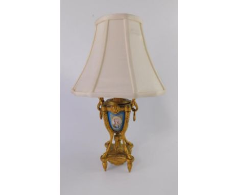 A French late 19thC gilt metal and porcelain table lamp, of urn form with leaf scroll and ring handles, bleu celeste porcelai