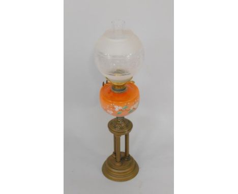 A Duplex late 19thC copper oil lamp, of triple column form, with an orange glass reservoir enamel decorated with flowers, and