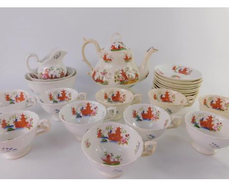An early 19th porcelain part tea service, chinoiserie decorated, comprising teapot, cream jug, sugar bowl, slop bowl, ten tea
