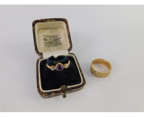 An amethyst and diamond three stone ring, set in yellow metal, size M, and a 9ct gold and gem set eternity band, size P, 5.7g