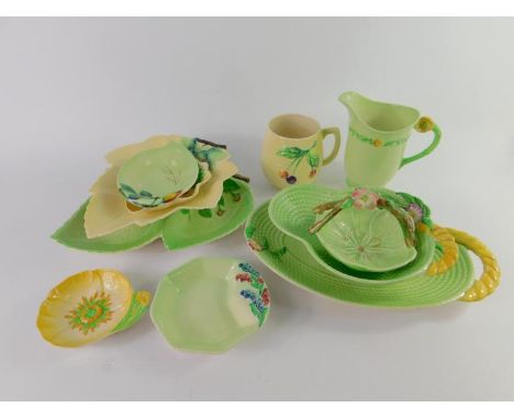 A group of Carltonware leaf ware pottery, moulded with flowers and buds, basket weave dishes, mug moulded with cherries and s