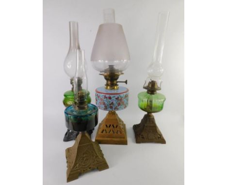 A Victorian oil lamp  with a foliate painted turquoise glass reservoir, on a cast iron base, frosted glass shade, 59cm high, 