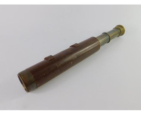 A Broadhurst Clarkson & Co brass four drawer telescope, leather bound, 79cm long extended.