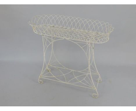 A white cast iron indoor flower trough, on integral stand, 85cm x 34.5cm x 79cm.