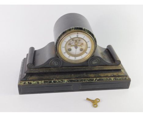 A Victorian slate and green marble mantel clock, enamel dial bearing visible brocot escapement, chapter ring with Roman numer