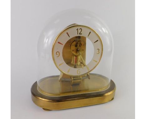 A Kundo battery operated brass mantel clock, Keininger & Obergfell, chapter ring bearing Arabic numerals at quarters, under a