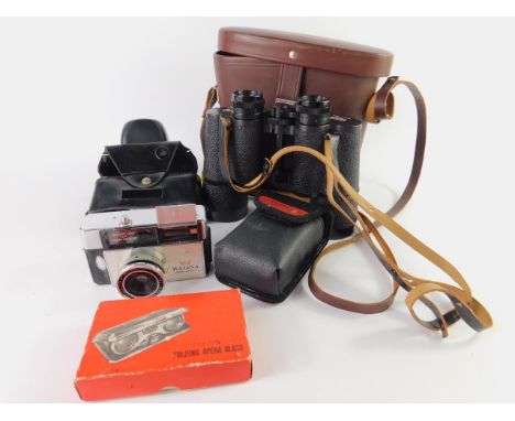 A Kodak 126 camera, with a Halina Achromat hard coated lens, Pierre Cardin racing glasses, Japanese folding opera glasses, bo