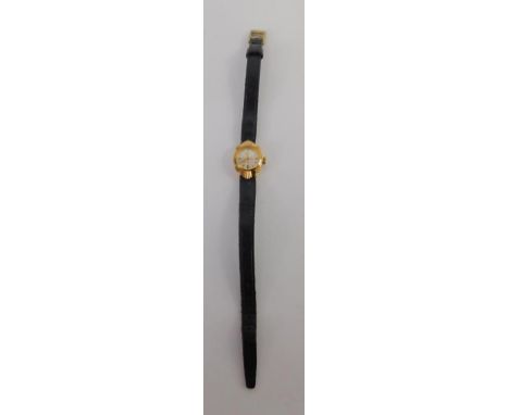 A Rotary lady's 9ct gold cased wristwatch, circular silvered dial, on a black leather strap.