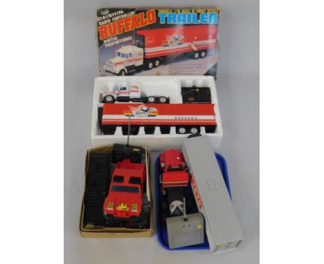 A Daishou radio controlled Buffalo Trailer, scale 1:30, boxed. a Liklo radio controlled Ray May transport, B3944, a Shinsei r