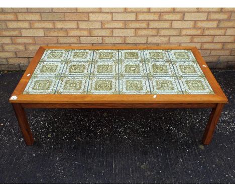 A vintage, tile top coffee table, approximately 42 cm x 123 cm x 72 cm
Items must be paid for and collected by close of busin