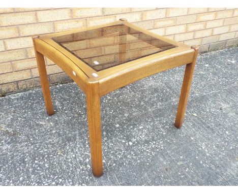 An Ercol, glass topped lamp / occasional table, approximately 49 cm x 59 cm x 59 cm
Items must be paid for and collected by c