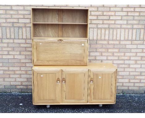 An Ercol sideboard with upper shelving section, approximately 162 cm x 136 cm x 45 cm
&nbsp;
Condition Report: Appears in goo