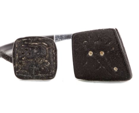 ANCIENT PERSIAN BLACK STONE AMULET,circa 400 B.C., with carved 'magical' symbols or script to both sides, 2cm x 2cm, together