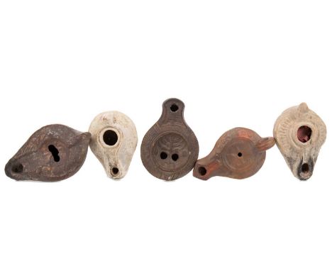 GROUP OF FIVE ANCIENT ROMAN TERRACOTTA OIL LAMPS,circa 2nd/3rd century A.D., each approximately 8cm long, with Certificate of
