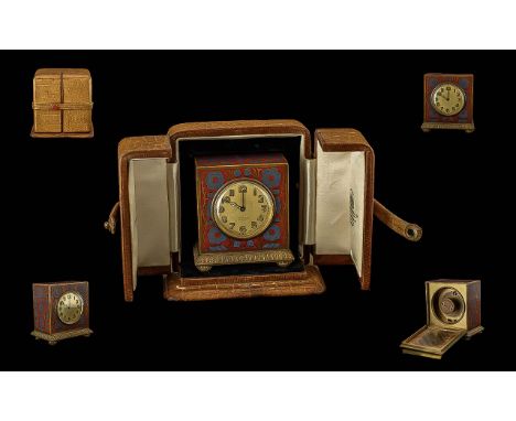 A Zenith 8 day Travelling Clock, enamelled case, in fitted leather box, No. 11303.  Case marked Hunt & Roskell Ltd, in Allian