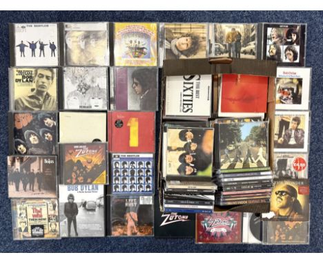 Box of CDs, includes 13 by the Beatles, Bob Dylan, Elvis, etc.