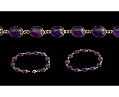 Ladies Pleasing 9ct Gold Amethyst Set Bracelet, Marked 9ct. The Well Matched Cabouchon Cut Amethyst of Good Colour, Length 6.