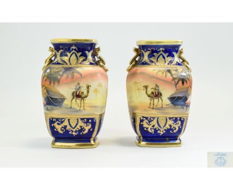 Noritake Fine Quality Pair of Hand Painted Twin Handle Vases with Painted Scenes of Desert Landscapes, Bedouins and Camels, P