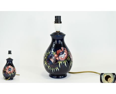 W. Moorcroft Signed Lamp Base ' Anemone ' Design on Blue Ground. Label to Base Reads - Potters to the late Queen Mary. 11 Inc