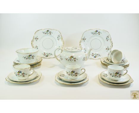 Phoenix China Part Teaset comprising teapot, sugar bowl sandwich plates, cups, saucers and side plates. Bird and foliage deco