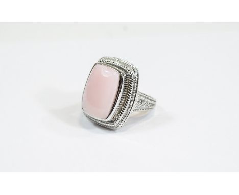 Pink Opal Cabochon Ring, an elongated cushion cut cabochon of pink opal, measuring 11.75cts, bezel set in platinum vermeil an