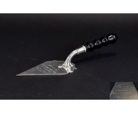 A 1930's Commemorative - Shaped Triangular Bladed Silver Trowel with Ebony Handle. Hallmark Birmingham 1938, Presented to Com