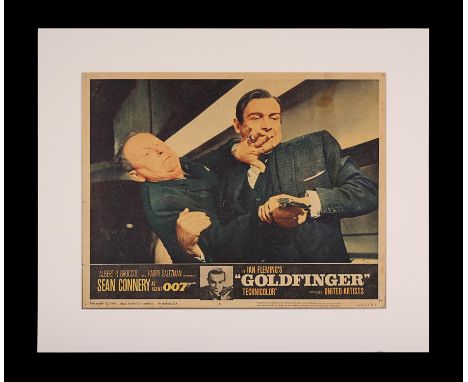 Artist: Unknown ArtistA mounted original US Lobby Card for the Sean Connery James Bond film "Goldfinger" (1964). The LC shows