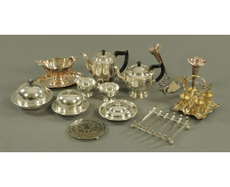 A quantity of silver plate to include a Viners four piece tea set, three muffin dishes and covers, an egg cruet stand with sp