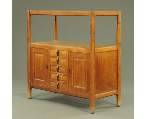 A Gordon Russell & Son oak sideboard/buffet, the rectangular top with chamfered edges and supported upon inverted tapering oc
