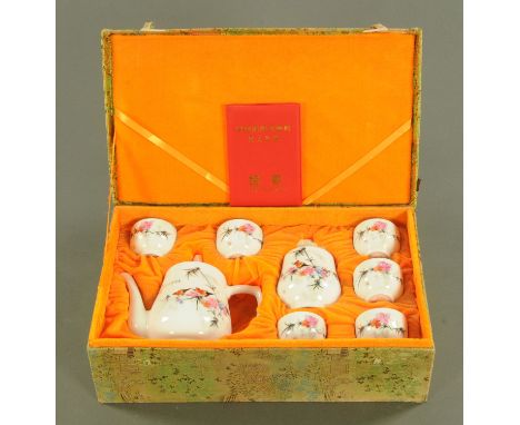 A Chinese porcelain tea service, late 20th century, in fitted presentation case.