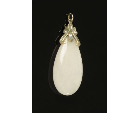A white jade teardrop shape pendant, with white gold coloured metal mount.  Height 50 mm, width 22 mm.