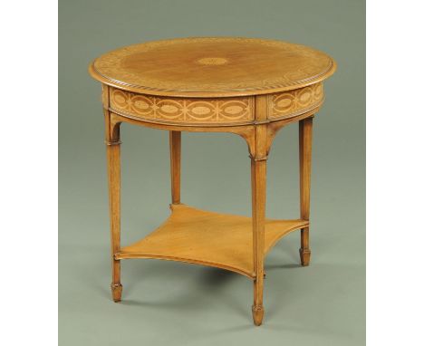 An Edwardian mahogany centre table, circular and inlaid with bellflower and scrolls raised on tapered legs of square section 