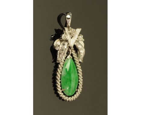 A Chinese 18 ct white gold mounted jade pendant, set with three small diamonds, stamped "8 K", 2.6 grams.  Height 35 mm. COND