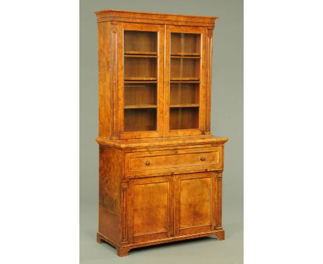 A Victorian walnut secretaire bookcase, with moulded cornice above a pair of glazed doors enclosing adjustable shelves and fl