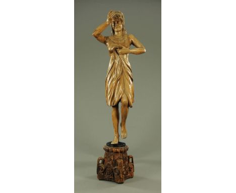 A hand carved wooden figurehead, draped female figure raised on an architectural capital.  Height 220 cm.  CONDITION REPORT: 