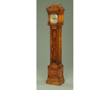 A walnut veneered grandmother clock, early 20th century, with square silvered dial with Roman and Arabic numerals and cherub 