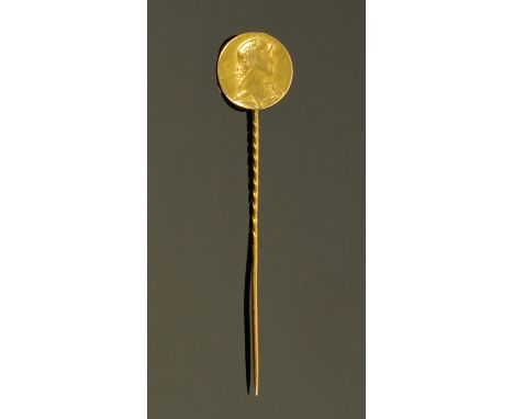 A Continental 18 ct gold Art Nouveau stick pin, the circular terminal decorated with a young girls head in relief, 1.4 grams.