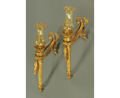 A pair of brass side light fittings, in the classical style, with ribbon swag mounts.  Height including glass shade 55 cm. 
