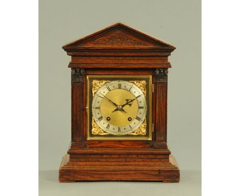 A Black Forest architectural mantle clock, circa 1900, the square brass dial with silvered chapter ring with Arabic and Roman