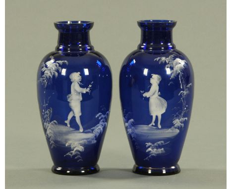 A pair of Mary Gregory blue glass vases, late 19th century, each hand painted with opaque white enamel of a young boy and gir