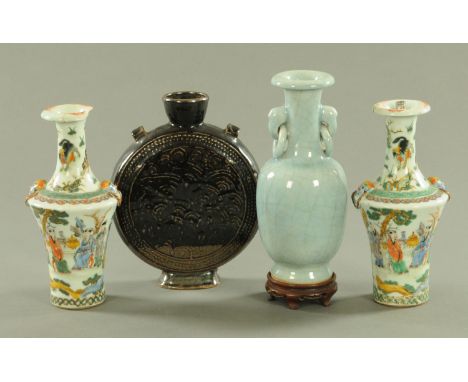 Four Chinese vases, to include a Ge glaze vase with trunk and ring handles, the glaze a light blue shade, a treacle glaze moo