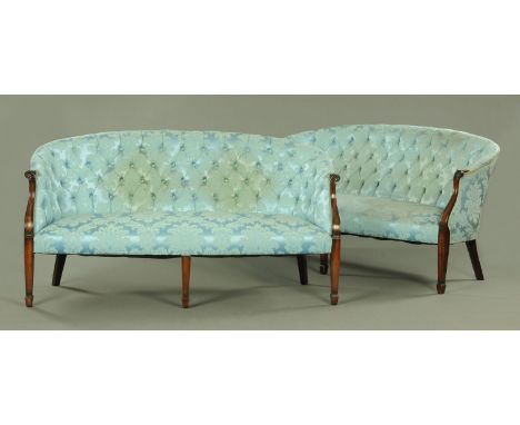 A pair of Georgian style button back settees, each with part mahogany frame, upholstered in jacquard blue floral material, wi